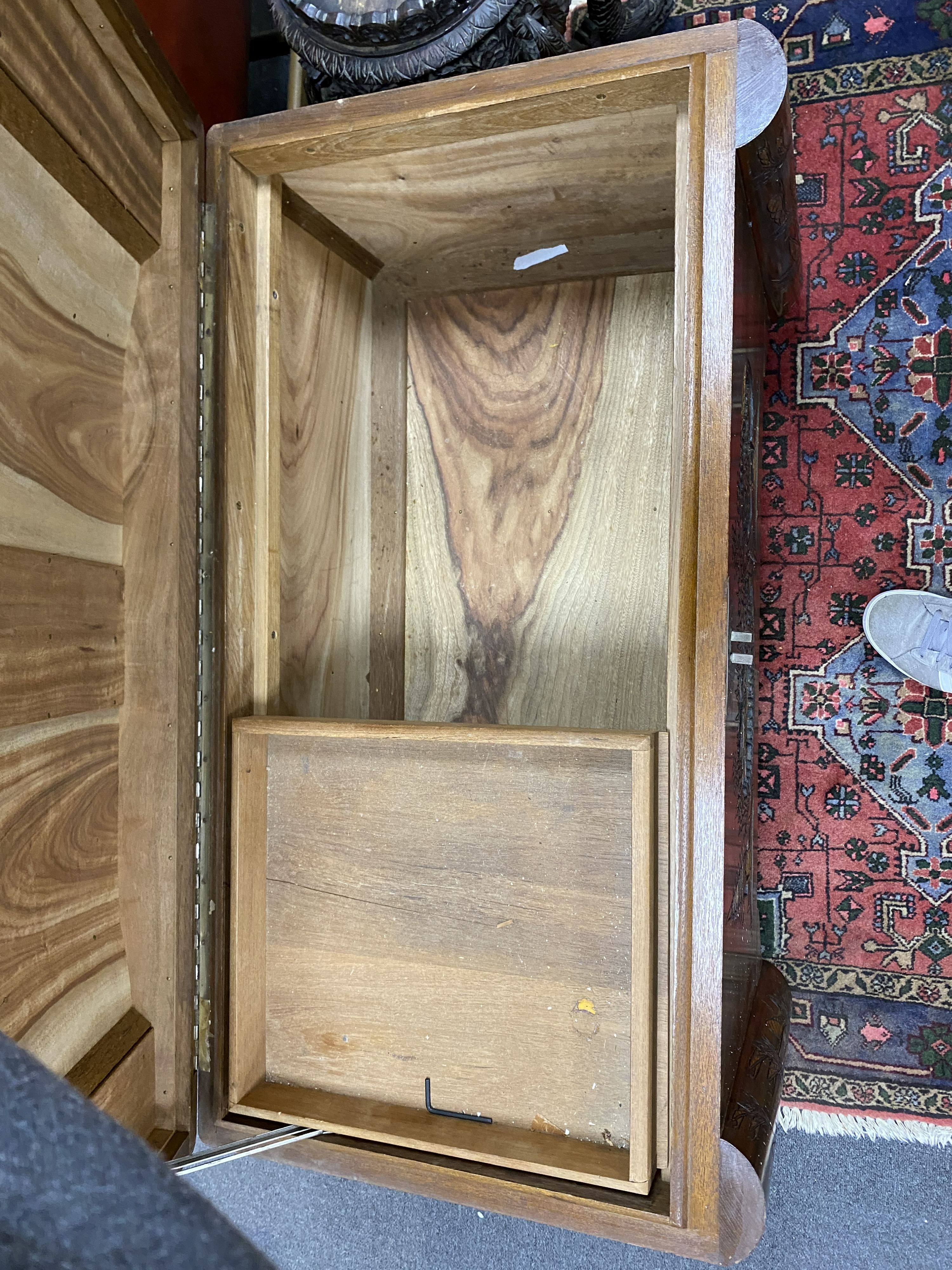 A Chinese carved teak and camphorwood lined chest, length 100cm, depth 54cm, height 64cm